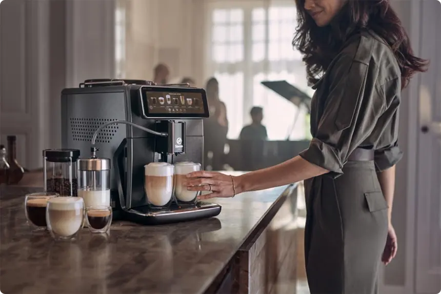 Image of a woman making cappuccino and different types of coffee with the coffee machine Saeco Xelsis Suprema SM8889/00. A Stars and Stories case study with Philips
